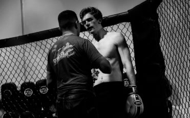 Coach assisting fighter